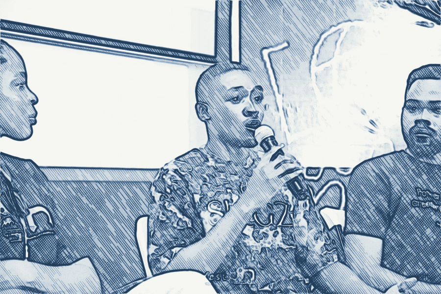 Shegz speaking on a panel at DevFest